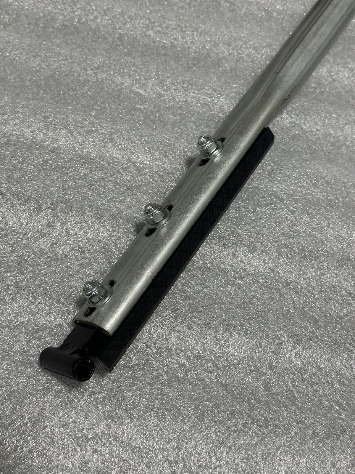 Adjustable tarp bow with integrated UHMW top rail slider