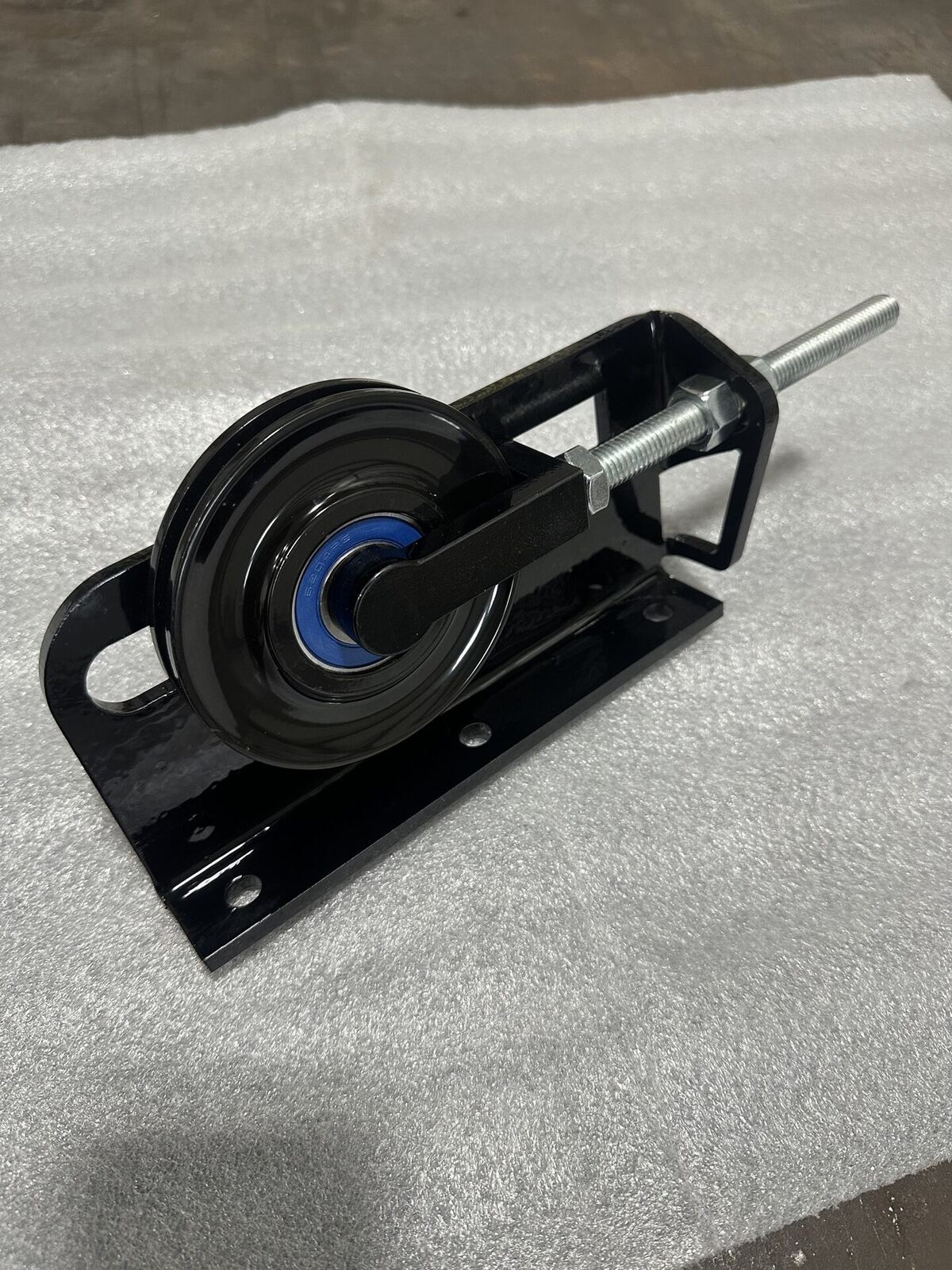 Rear pulley bracket assembly with billet tensioner
